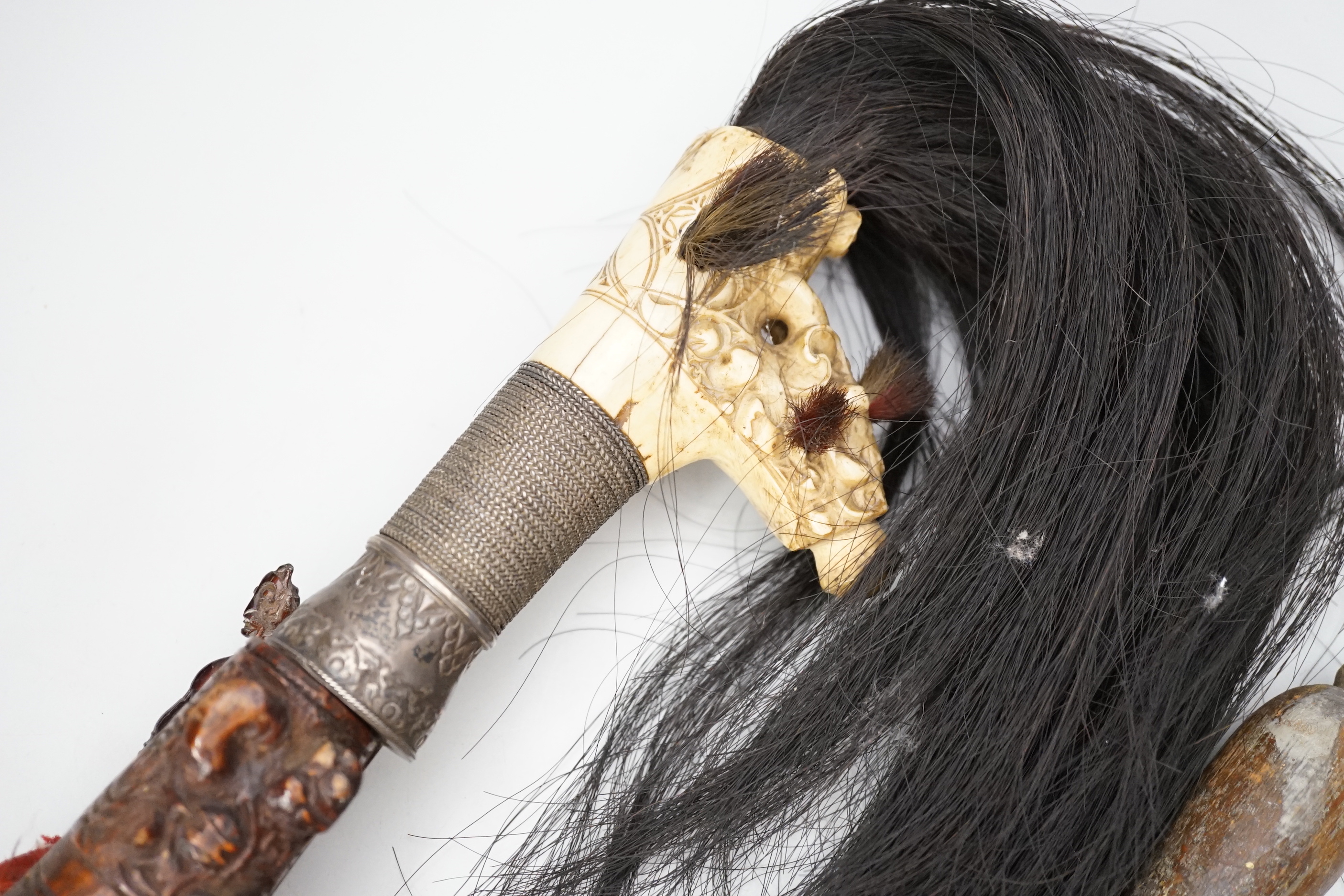 A Borneo 'headhunter's sword', a bone carving and feather swot (3), sword 77 cm long